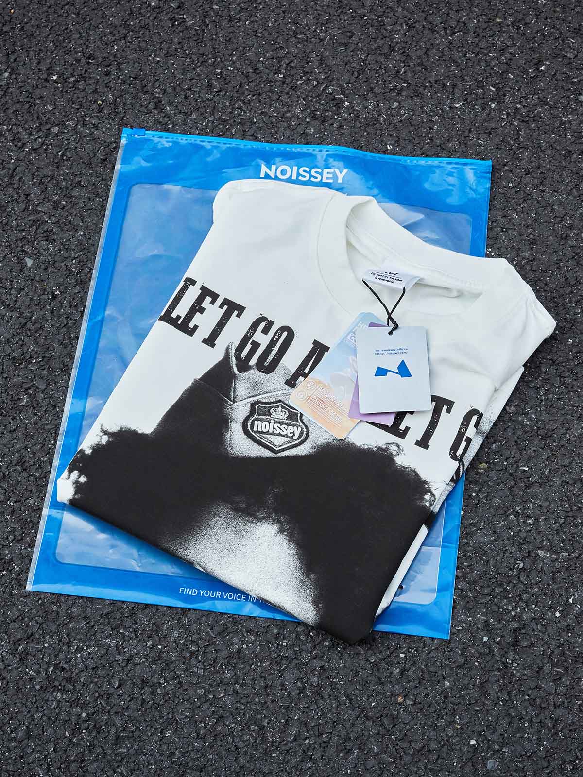 "Let Go and Let God." NOISSEY Boxy Oversized Graphic Tee – Vintage White