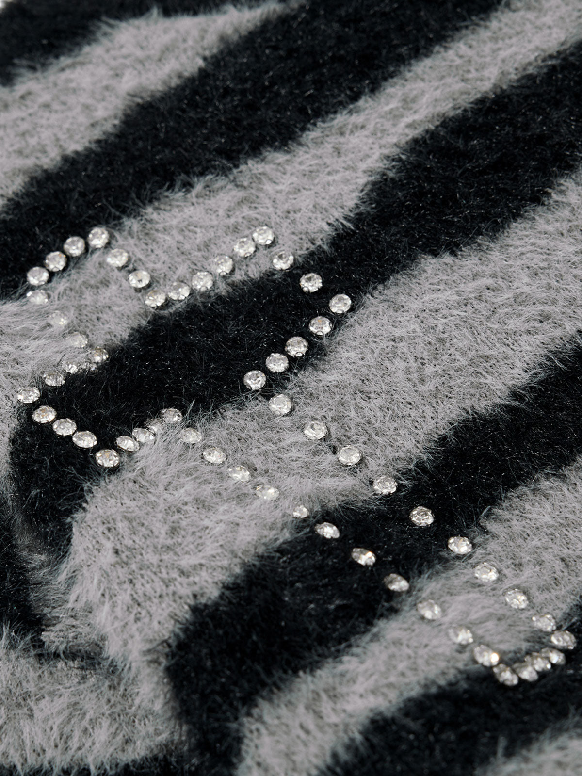 Zebra-striped cross plush sweater