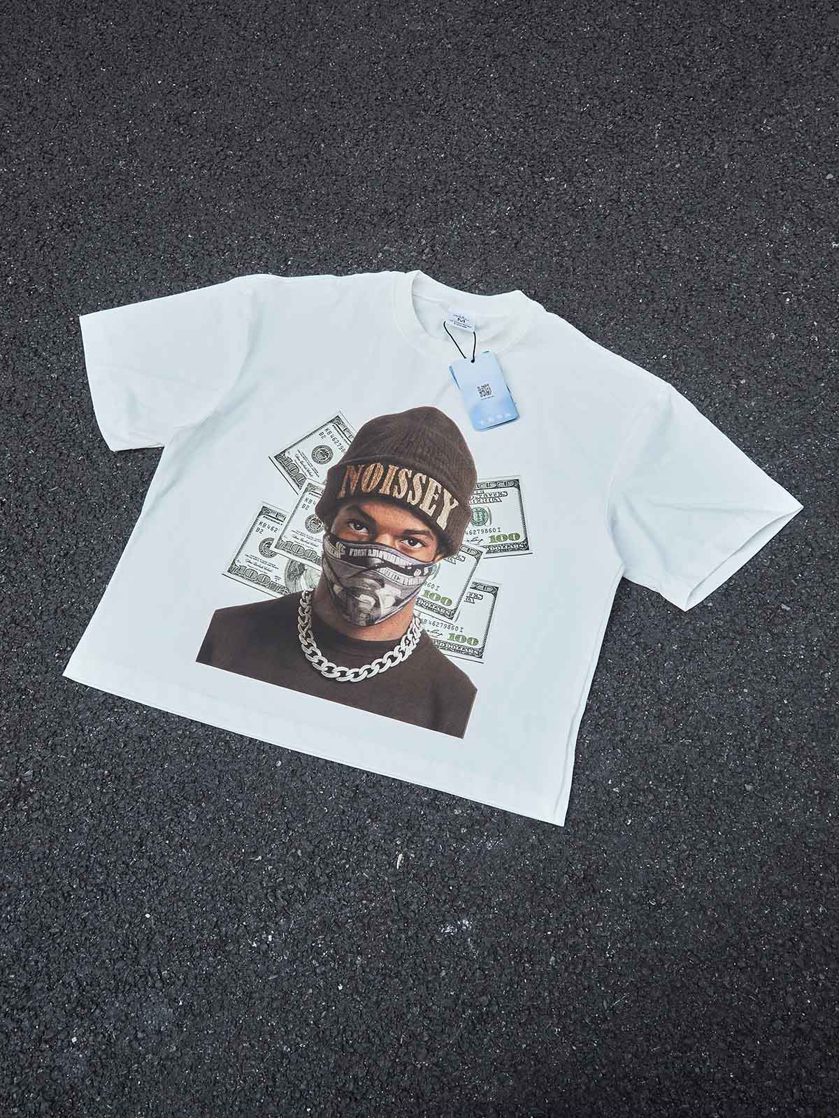 A flat-down view of the white boxy T-shirt showing its wide, cropped silhouette and oversized sleeves.