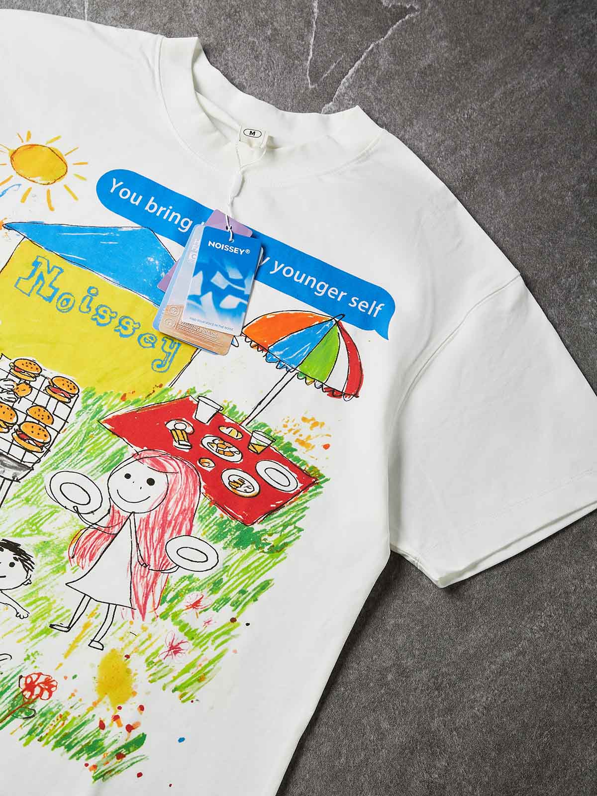 NOISSEY "Younger Self" Crayon Picnic Graphic Oversized Tee - Studio White