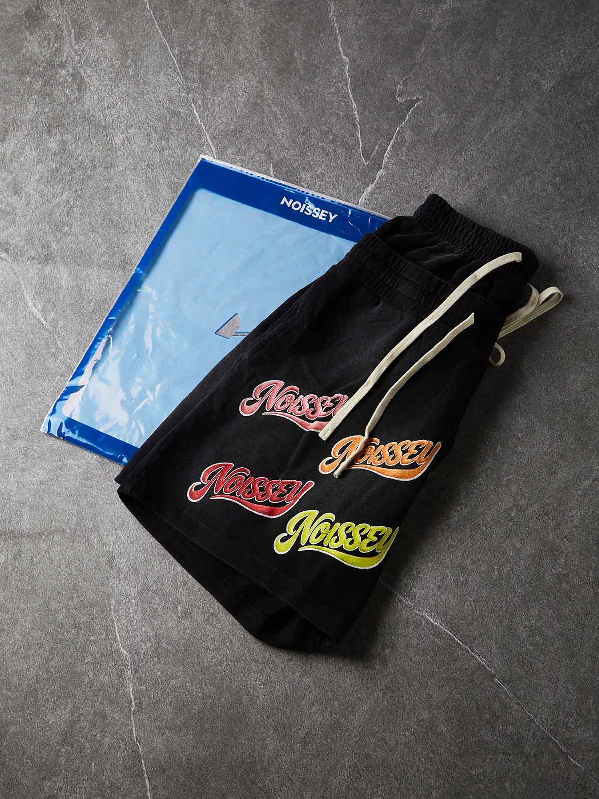 NOISSEY Washed Black Multi-Color Script LOGO Printed Oversized Sweat Shorts