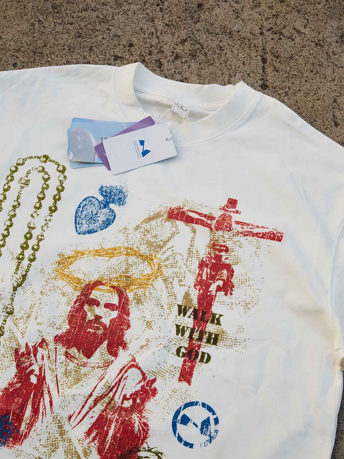 White T-shirt with colorful "Trust God's plan" screen print