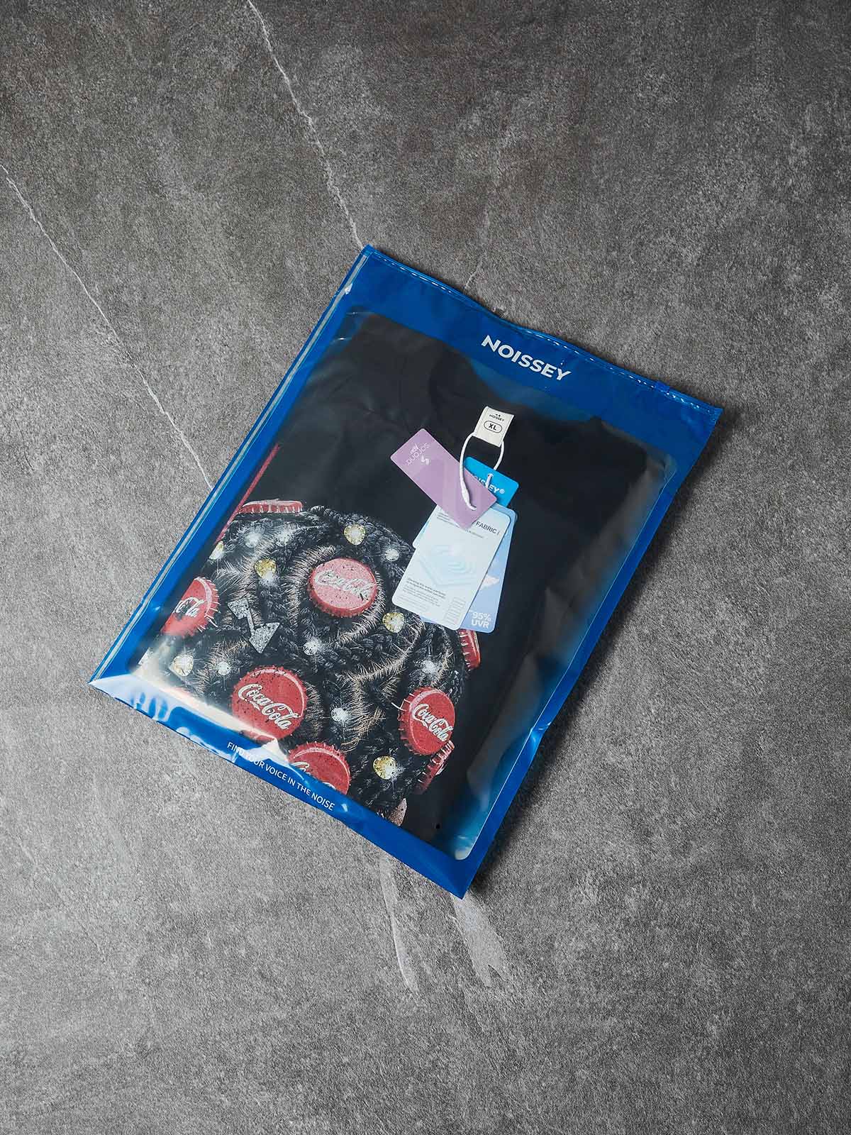 NOISSEY "BOTTLE CAP BRAIDS" POP ART - SHIMMERING OVERSIZED TEE