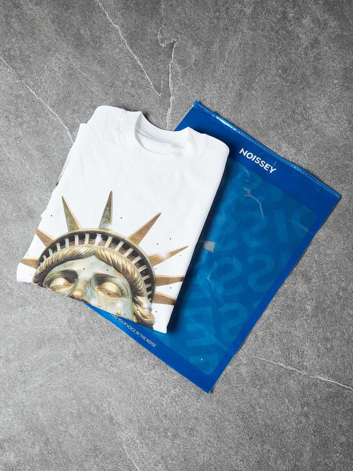 NOISSEY GOLDEN LIBERTY - BRONZE STATUE ICED OUT ART TEE