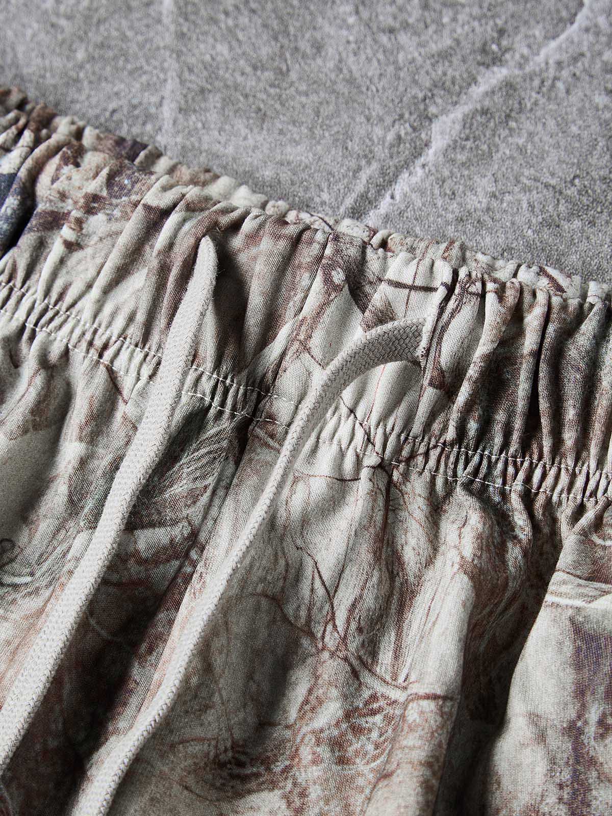 NOISSEY ALL-OVER PRINT CAMO TREE BARK CROSS CLUSTER SHORTS