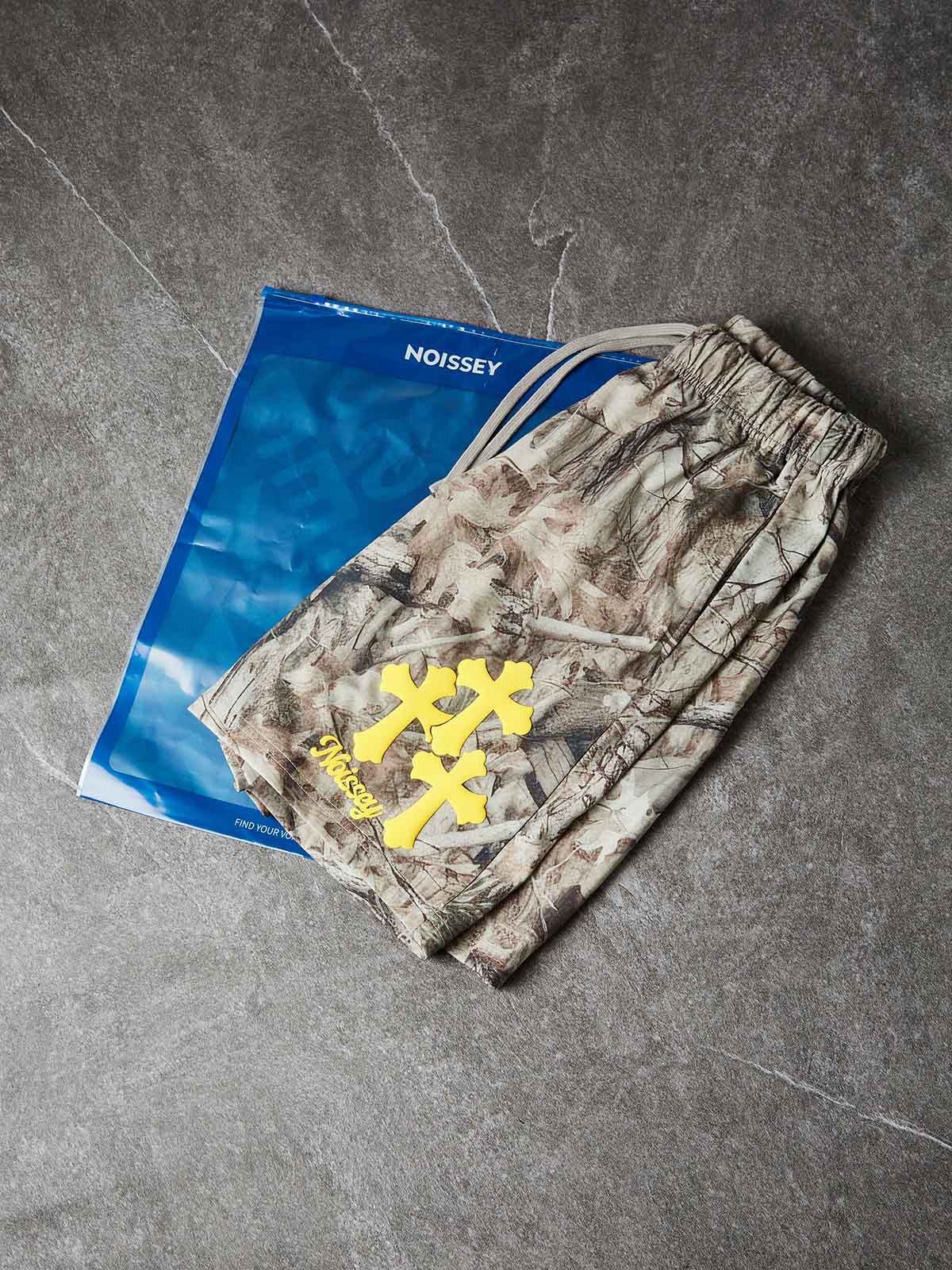 NOISSEY ALL-OVER PRINT REAL TREE BARK CROSS CLUSTER SHORTS