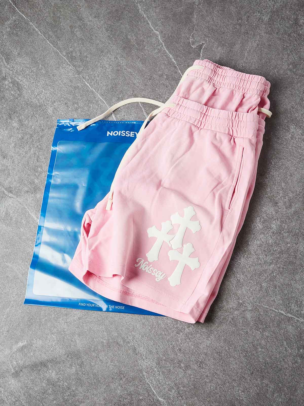 NOISSEY CHERRY BLOSSOM PINK WHITE CROSS CLUSTER GRAPHIC SHORTS