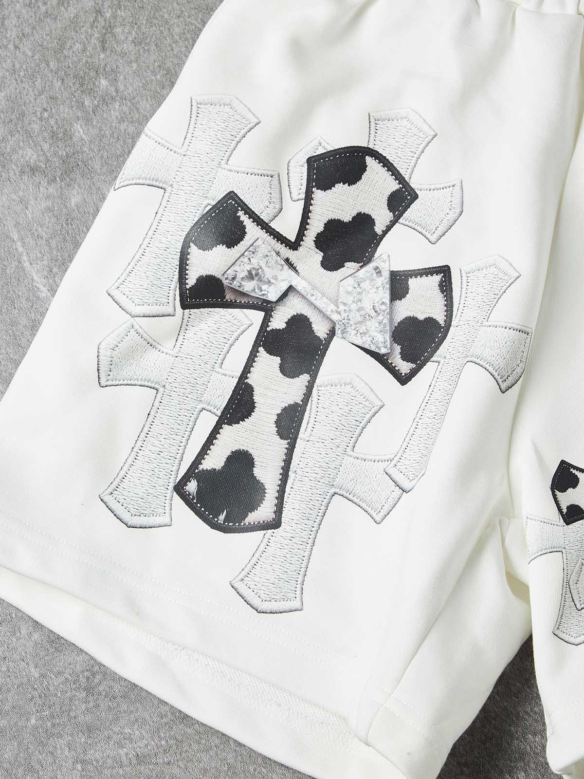 NOISSEY "COW CROSS" MONOCHROME APPLIQUÉ WIDE-LEG SHORTS