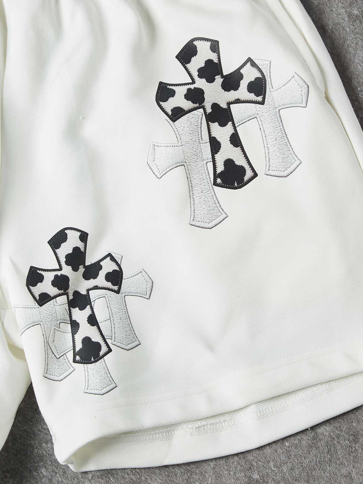 NOISSEY "COW CROSS" MONOCHROME APPLIQUÉ WIDE-LEG SHORTS