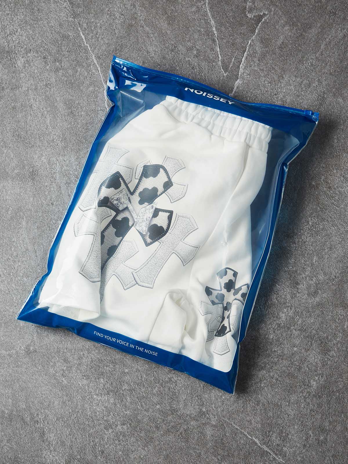 NOISSEY "COW CROSS" MONOCHROME APPLIQUÉ WIDE-LEG SHORTS