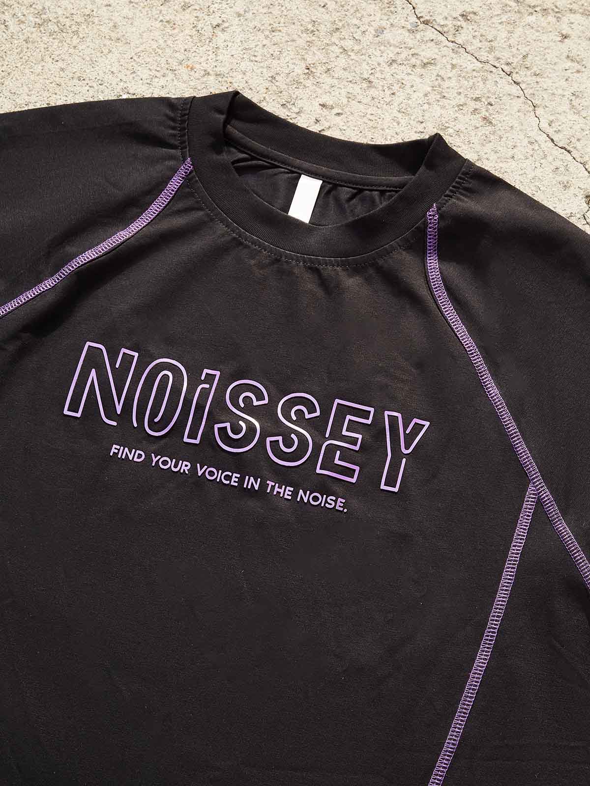 Close-up of NOISSEY logo and 'Find Your Voice' text printed on the chest in subtle purple tones.