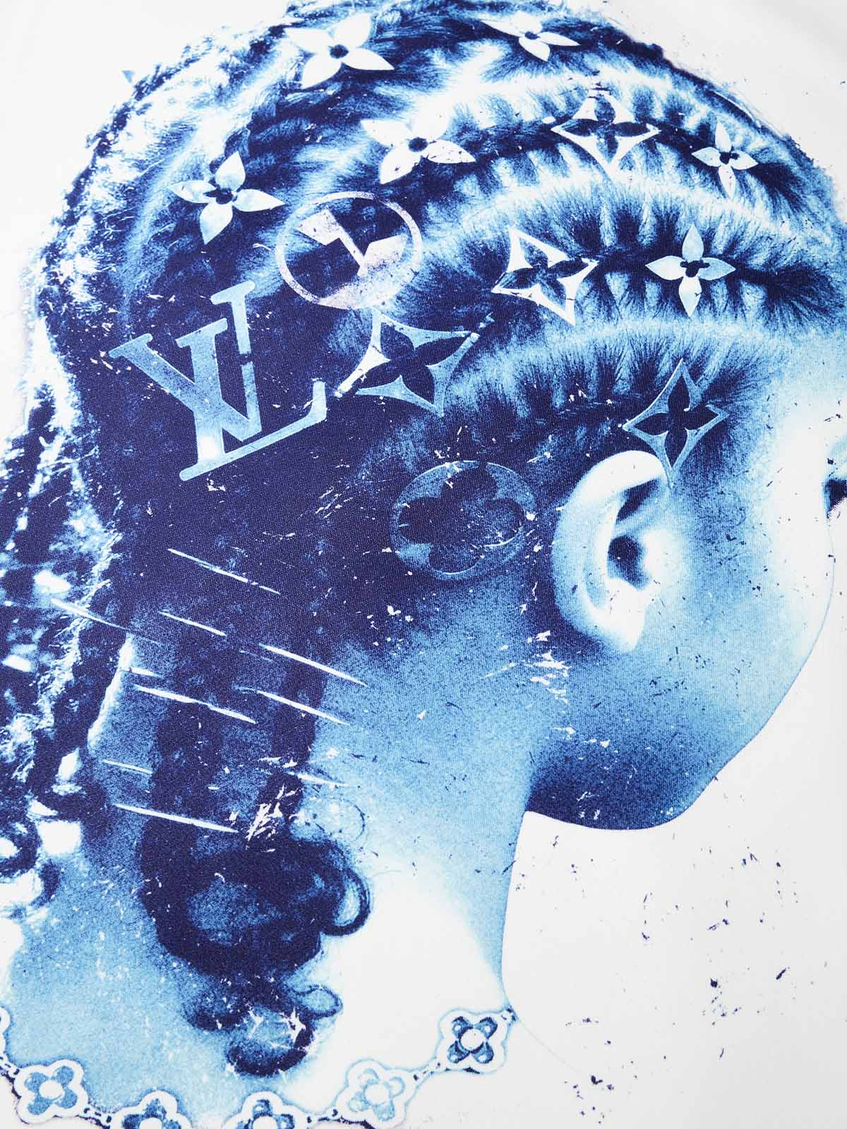 Close-up of blue side profile portrait showing cornrows with monogram pattern details