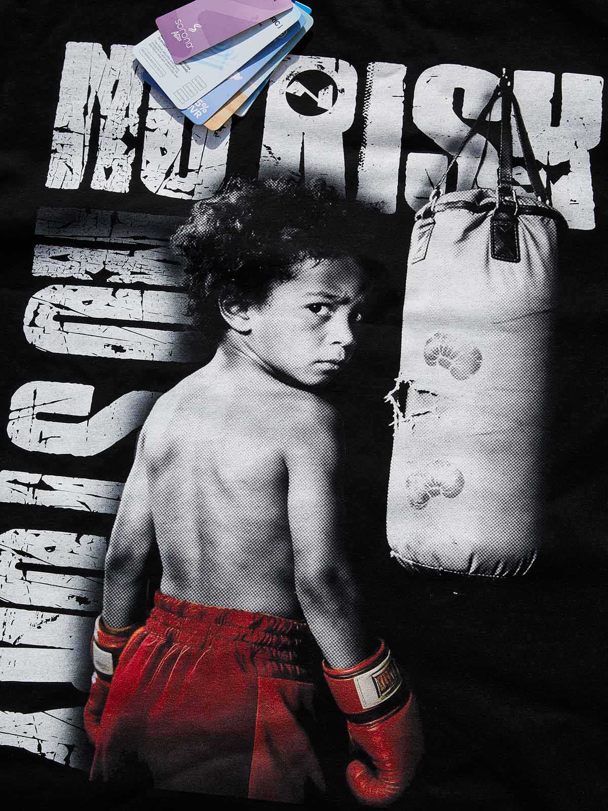 Close-up of distressed movie poster art showing a young boxer and "NO RISK NO STORY" text