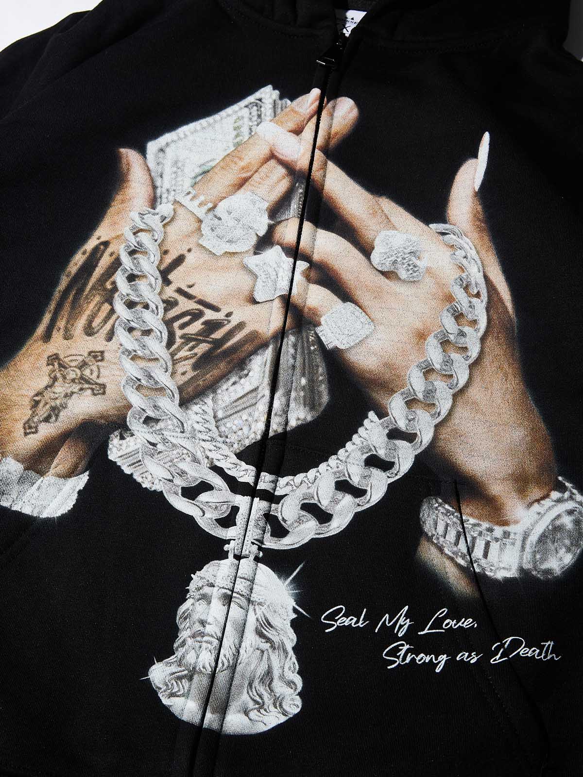 Close-up of hands holding money wearing diamond rings and Jesus pendant Cuban chain