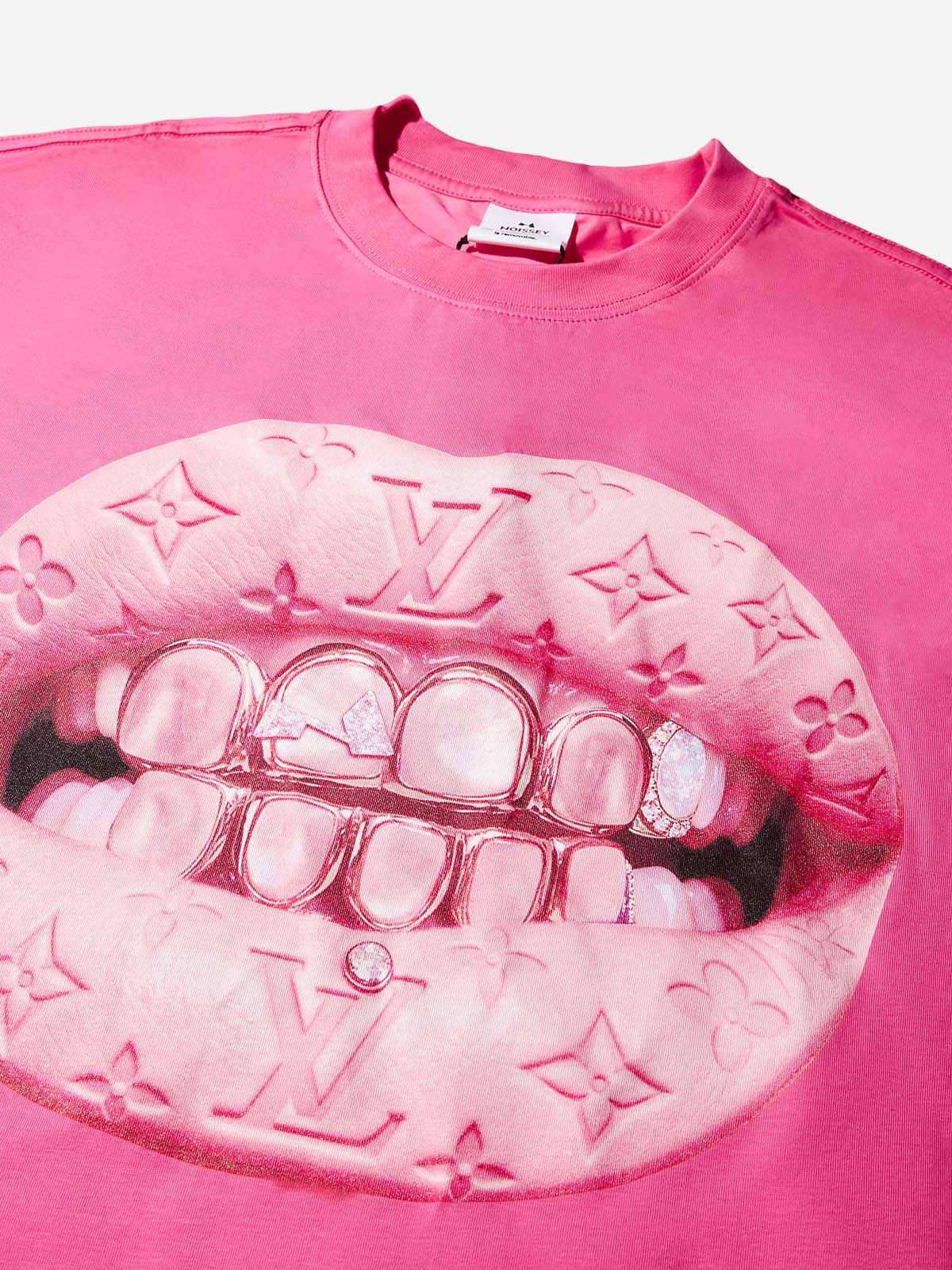 Close-up of pink lips with luxury monogram texture biting gold grillz