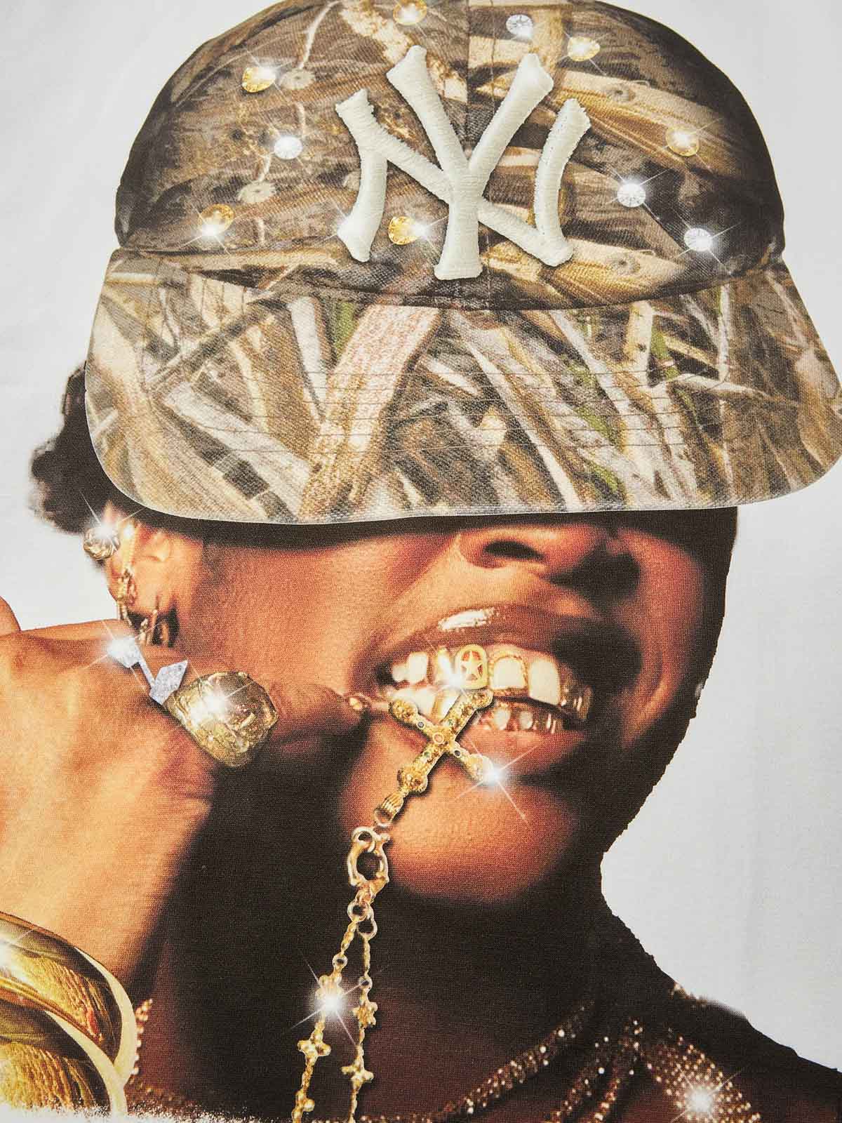 Close-up of portrait graphic showing a woman biting a gold chain wearing a bling camo hat