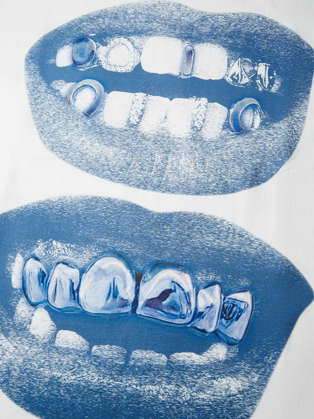 Close-up of the retro distorted blue lip and grillz graphic print