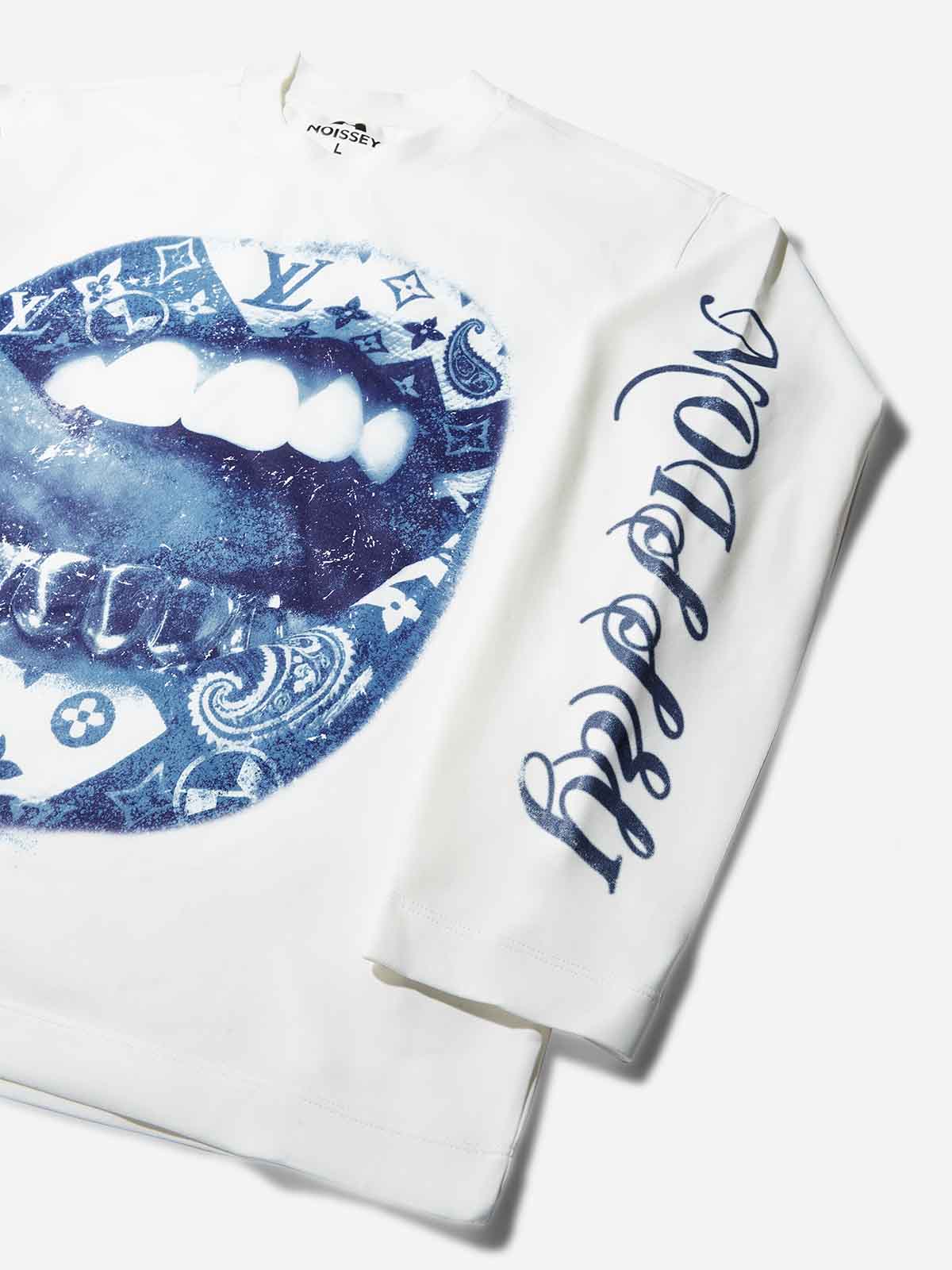 Detail of blue gothic NOISSEY text printed on the white sleeve of the sweatshirt