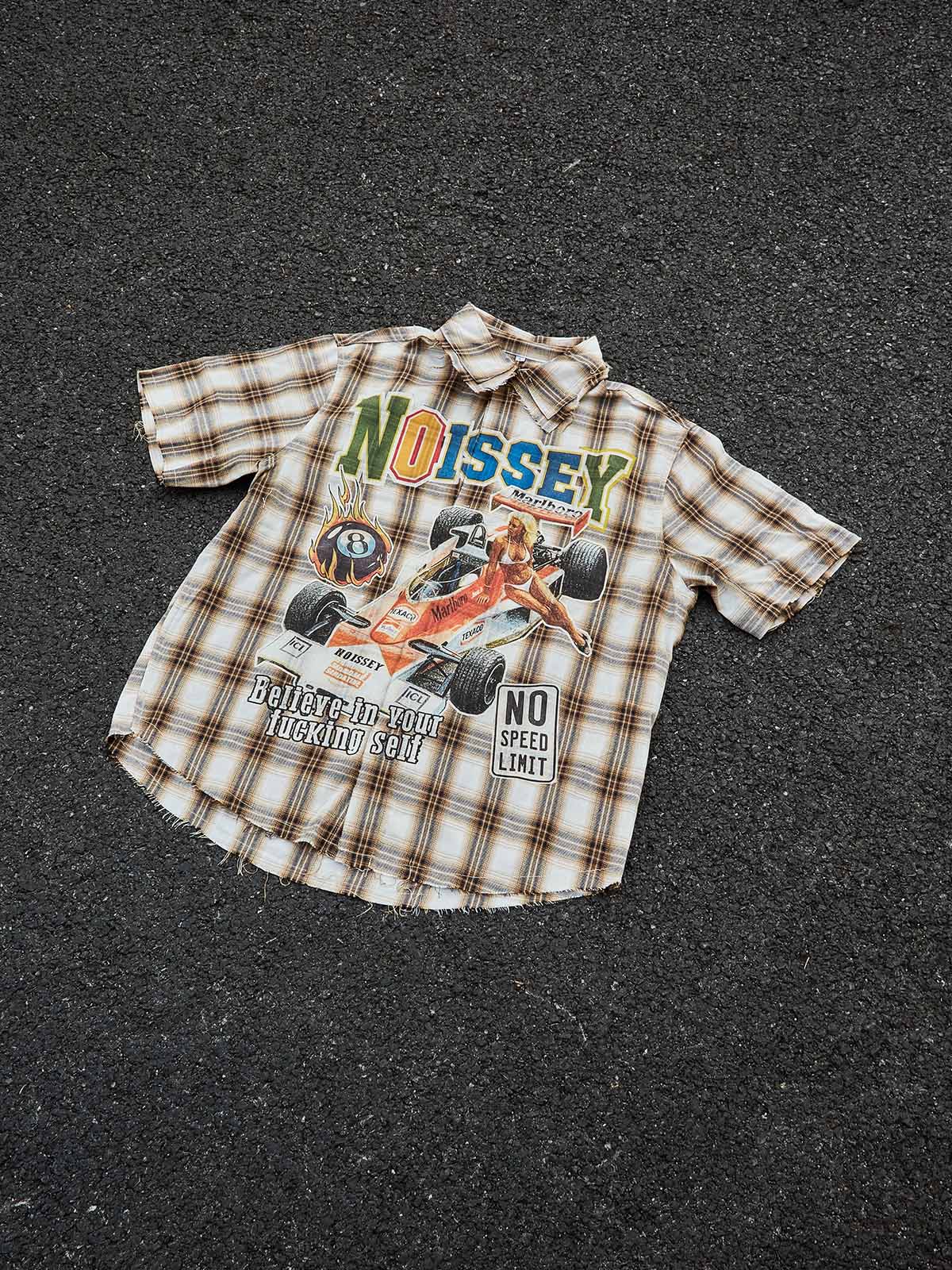 Flat lay of the racing queen plaid shirt showing the 4 included DIY badges.