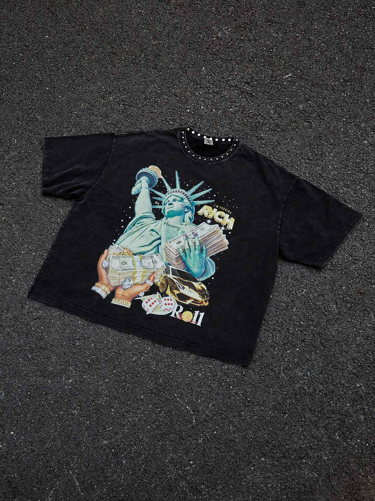 Flat lay of the studded collar wealth graphic tee on a light background.