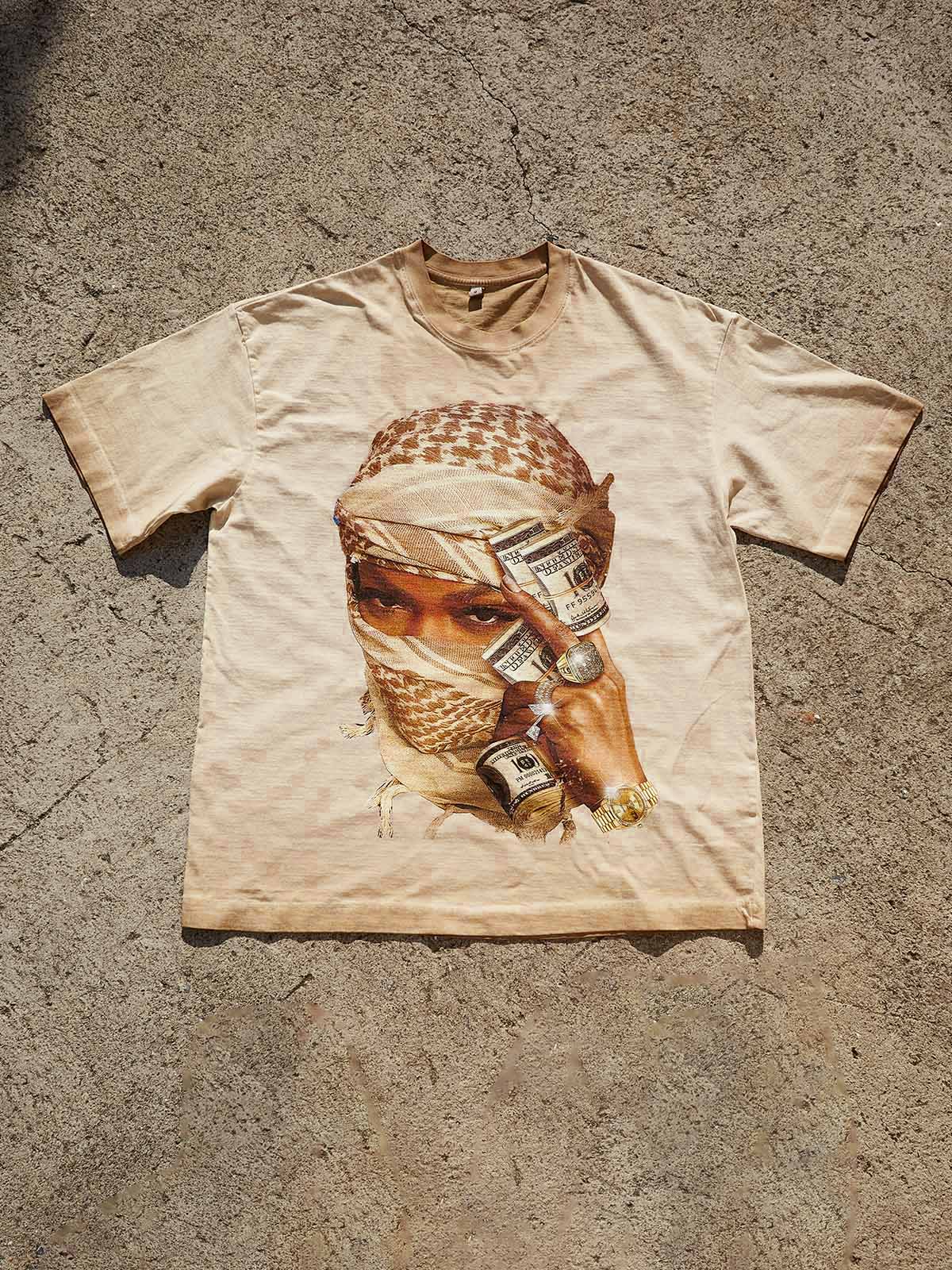 Flat lay view of the Desert-toned Bandana Print T-shirt showing the sand-colored fabric and high-contrast urban graphic.