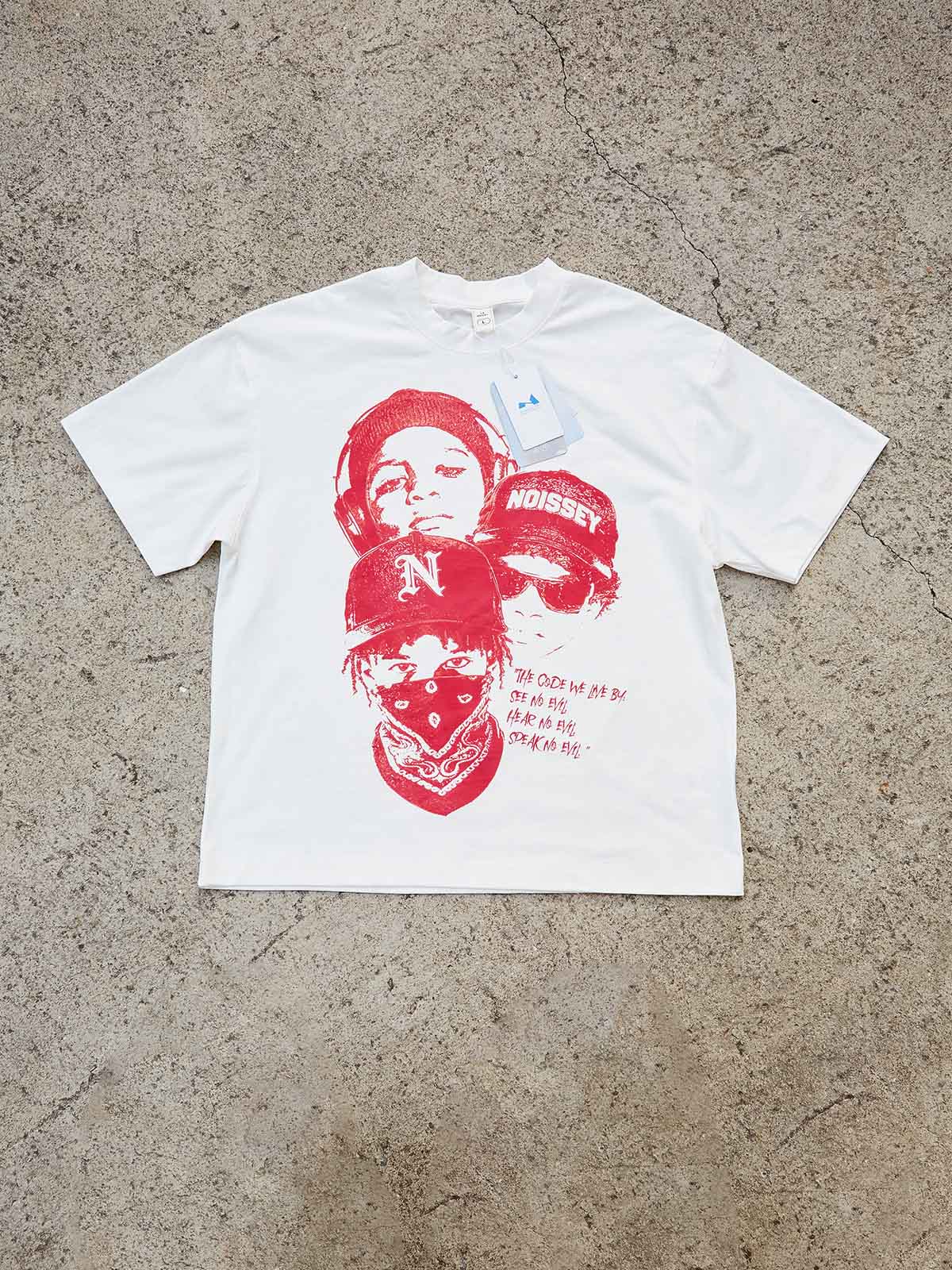 Front view of the "The Code We Live By" graphic tee showing the vibrant crimson print and classic crew neck design.