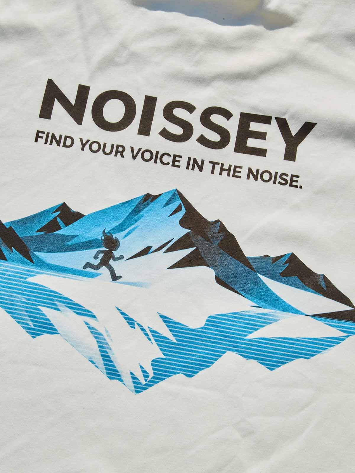Macro view of the blue mountain glacier print and high-quality screen-printed typography on the back of the shirt.