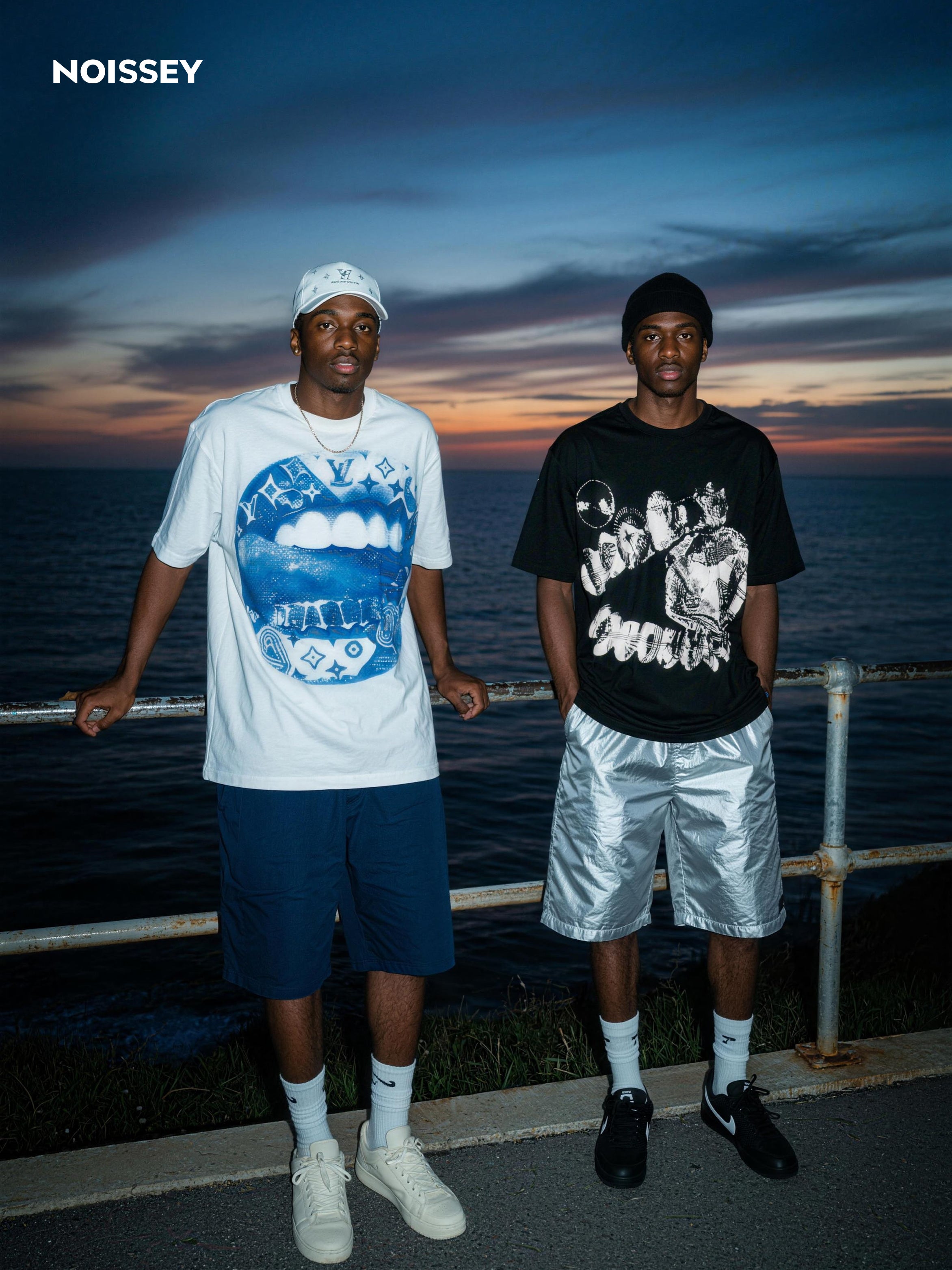 Male models wearing NOISSEY boxy fit cooling tees in a street setting