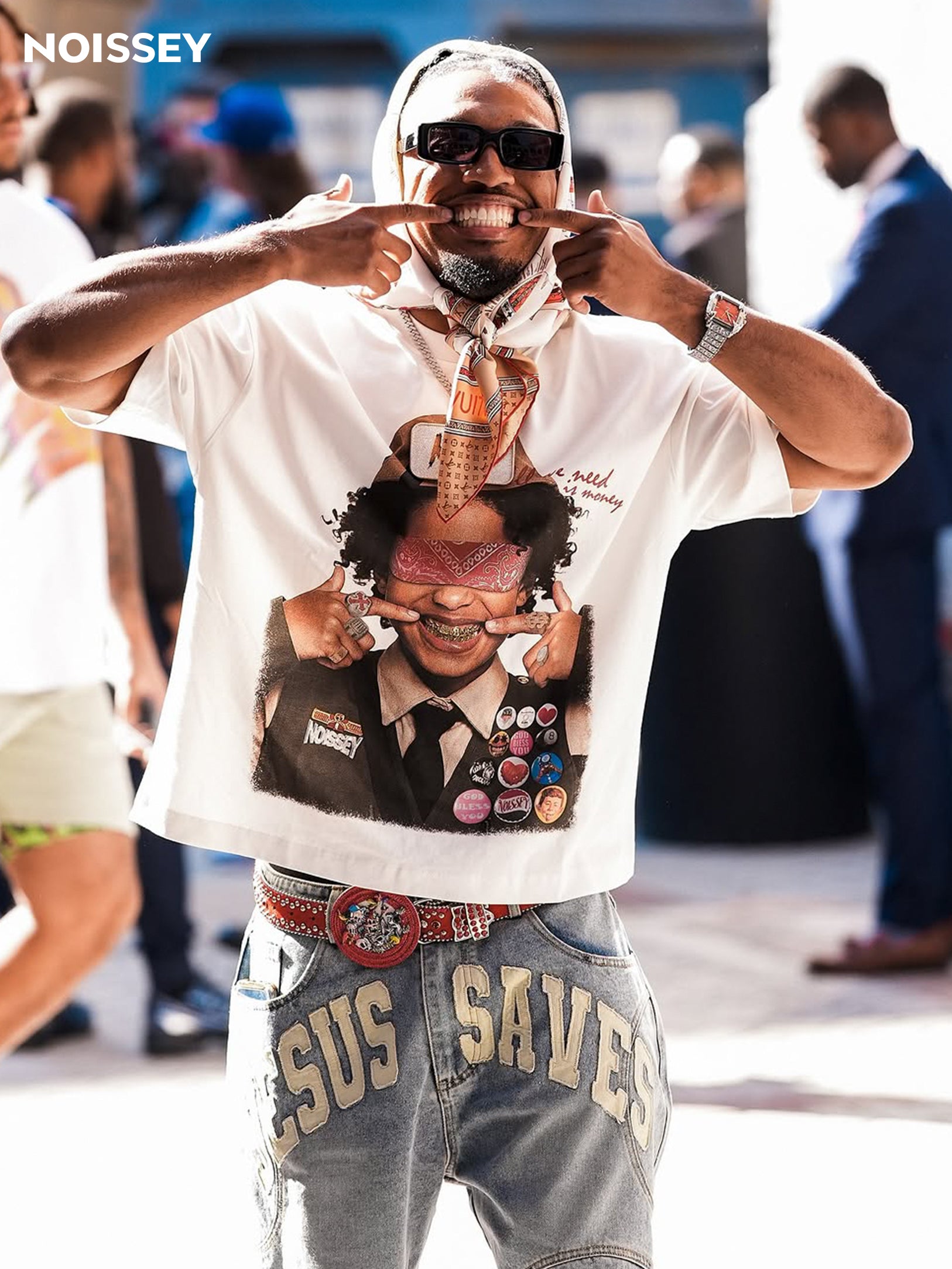 Male models wearing the oversized boxy DIY badge tee styled with baggy pants