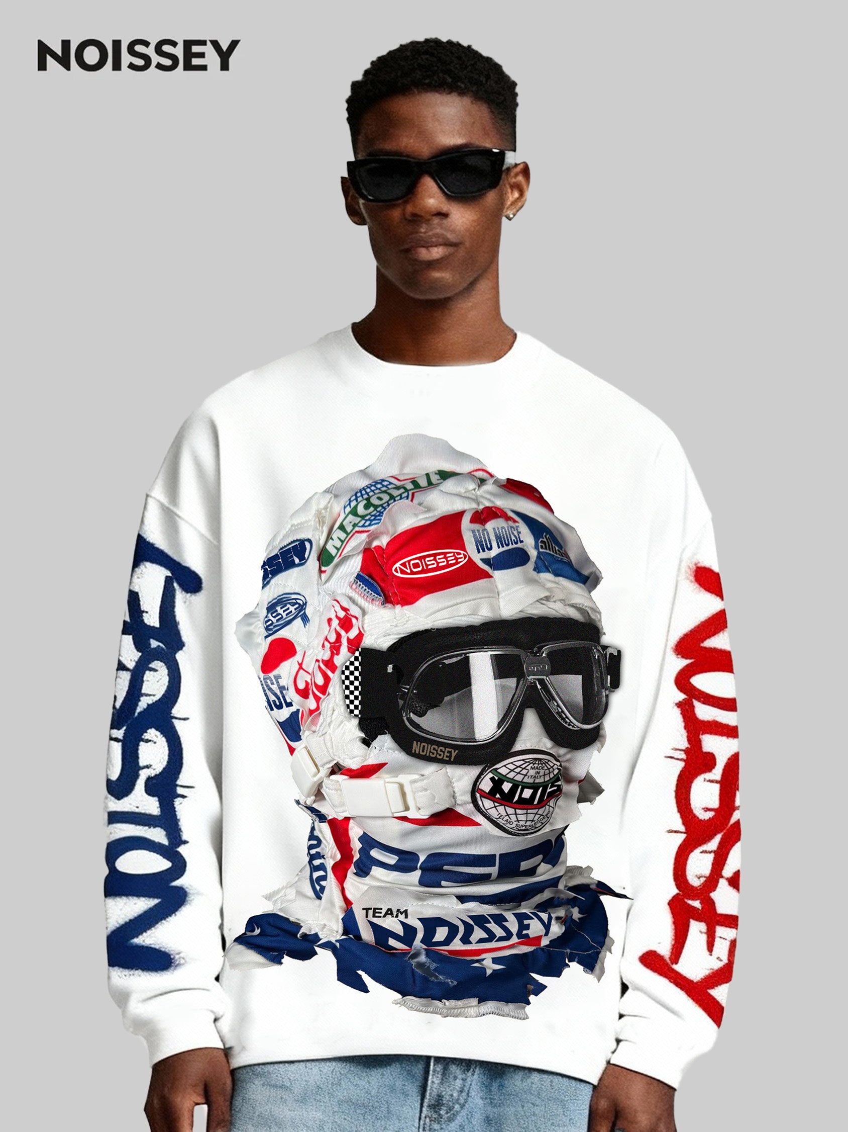 Model wearing NOISSEY racing long sleeve styled with Timberland boots next to a red Ferrari