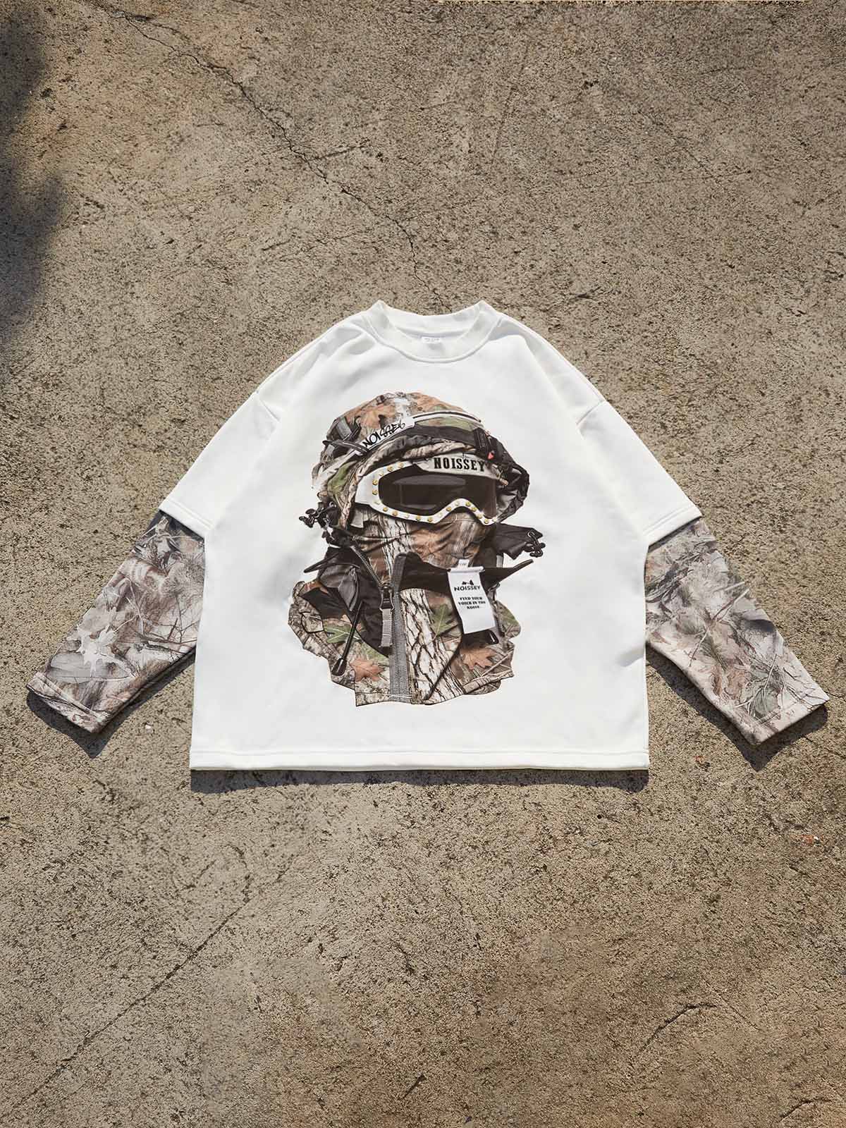 NOISSEY "Urban Stealth" long sleeve shirt showing the boxy fit and double-layered camouflage sleeve design.