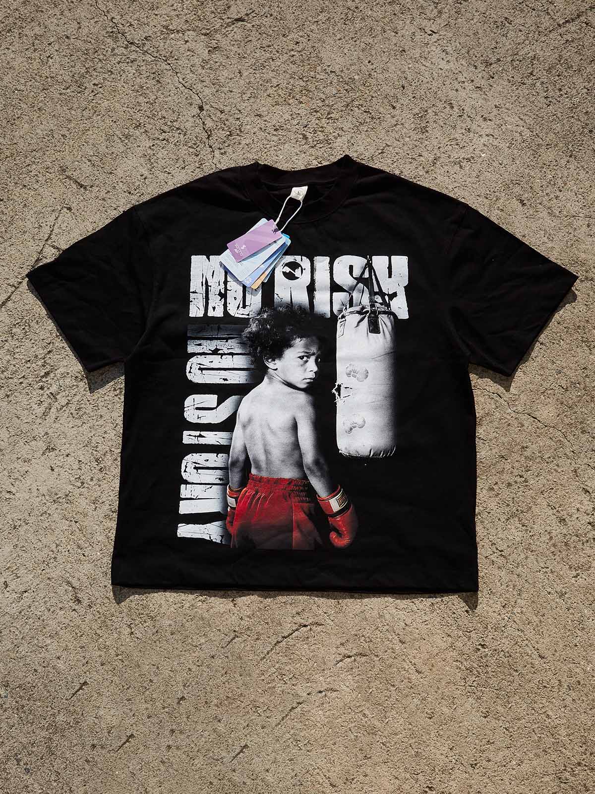 Oversized black cotton streetwear tee with cinematic graphic art print