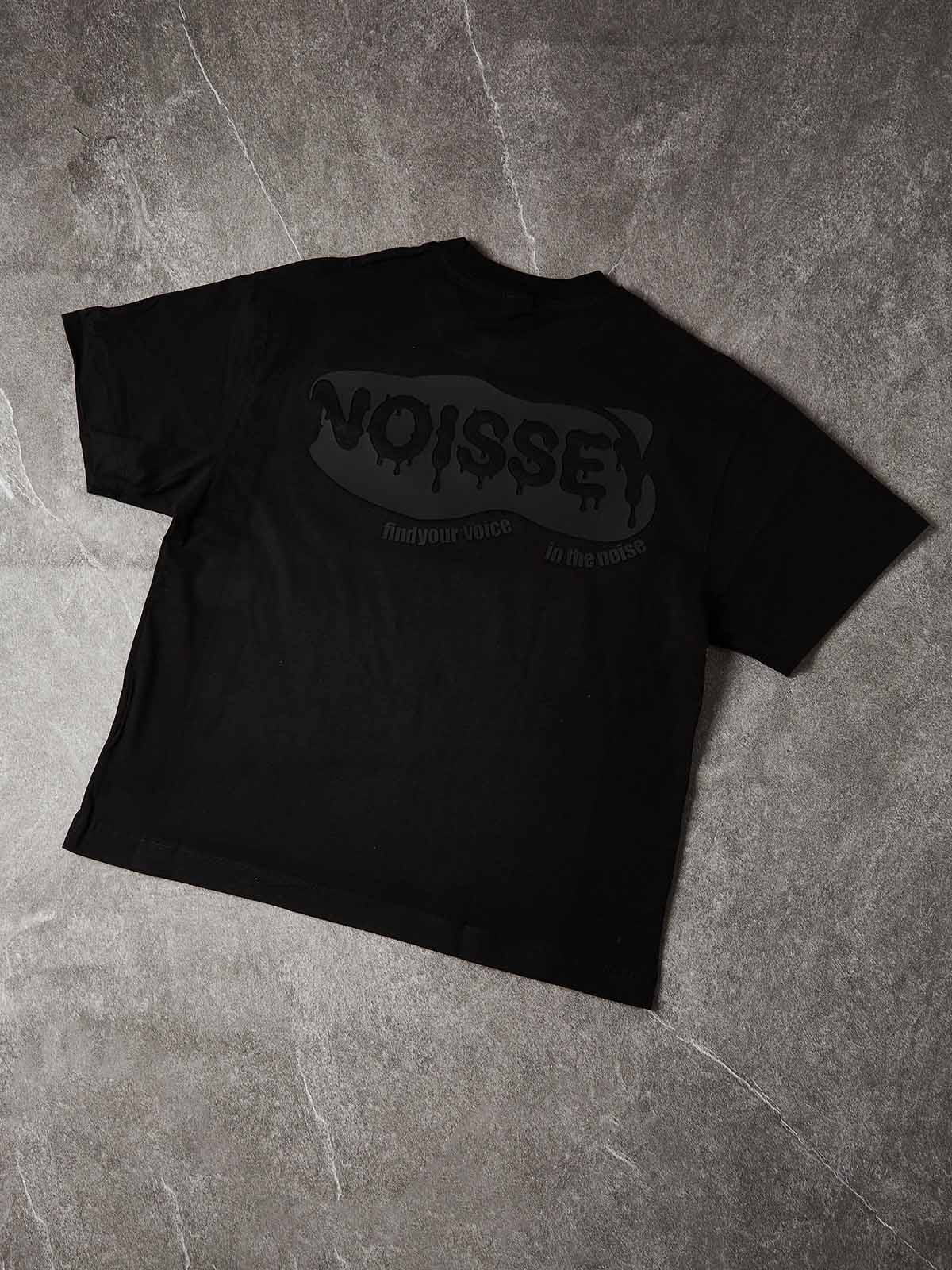 Studio layout of the 280GSM cotton tee highlighting the "Find Your Voice" tagline and the reflective, metallic texture of the liquid chrome print.