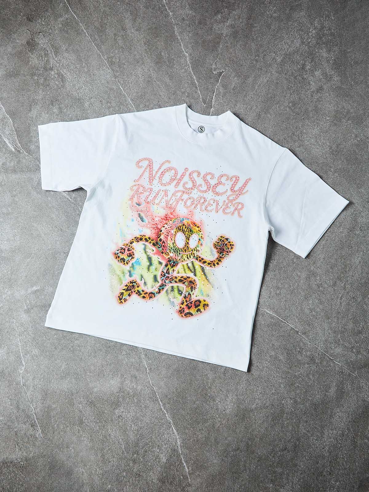 Studio layout of the 280GSM cotton tee highlighting the vibrant pink accents and the multi-color pastel energy trail behind the mascot.