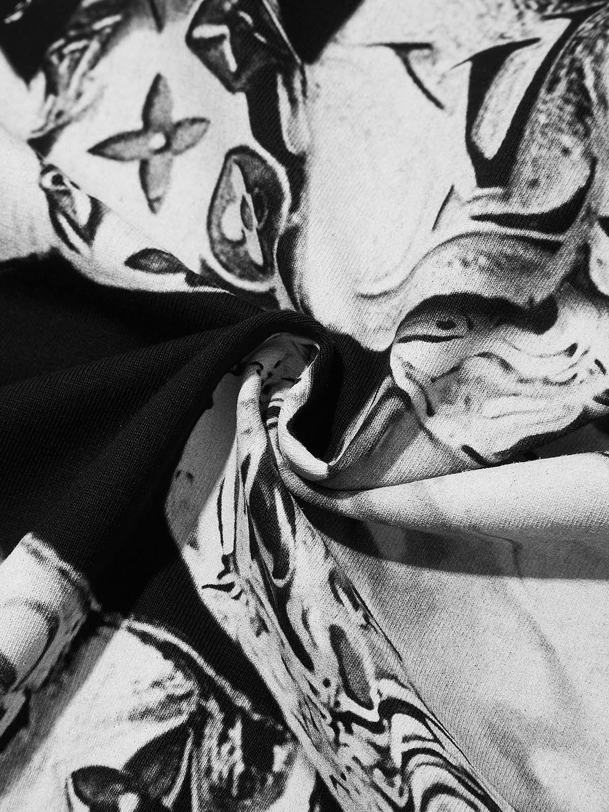 Texture shot of the black cooling fabric showing the smooth drape and print quality