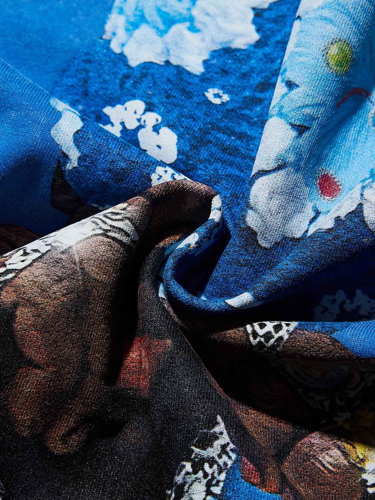 Texture shot of the sapphire blue cotton fabric showing vintage acid wash details at seams