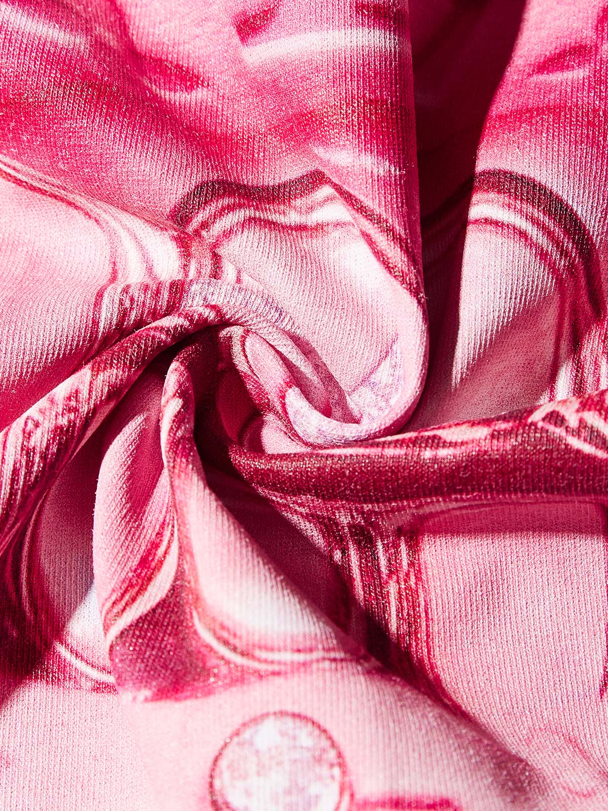 Texture shot of the smooth cooling pink fabric with moisture-wicking properties
