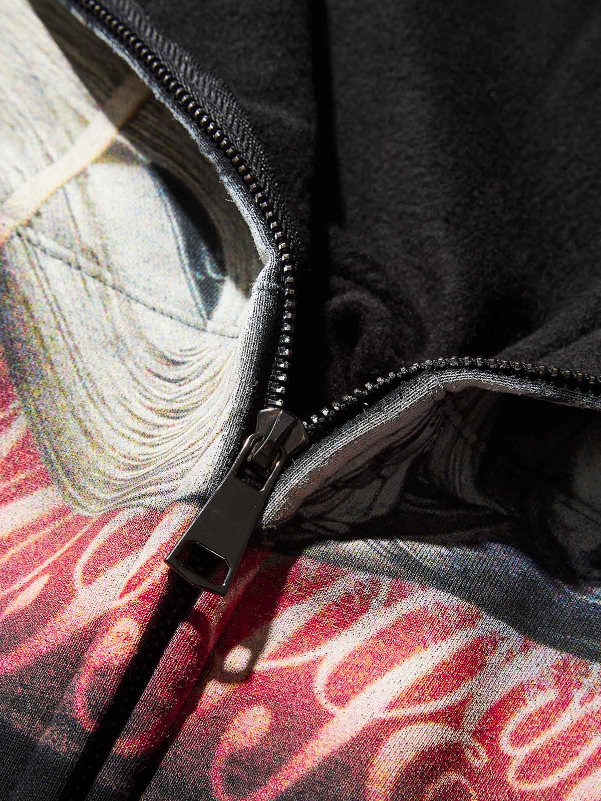 Texture shot of the soft black fleece fabric showing heat retention quality