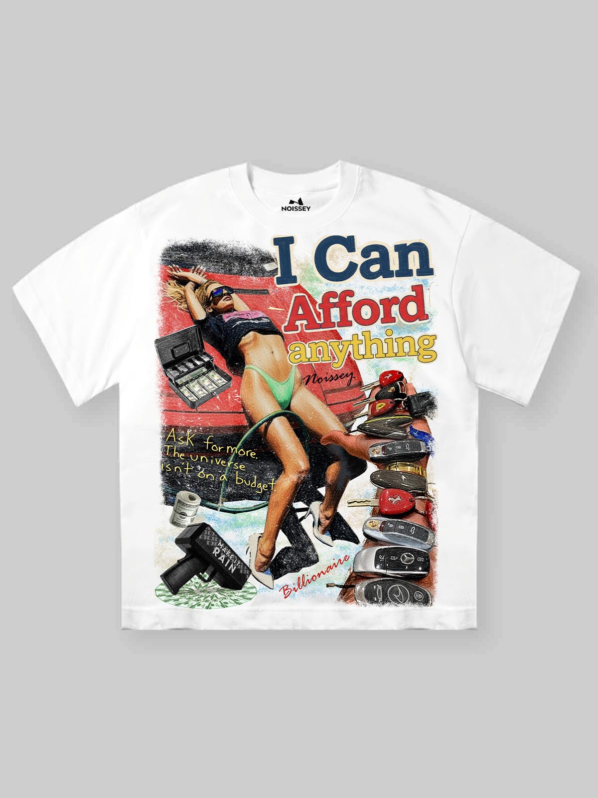 White oversized t-shirt featuring a colorful "I Can Afford Anything" collage print with luxury car keys and vintage graphic elements.