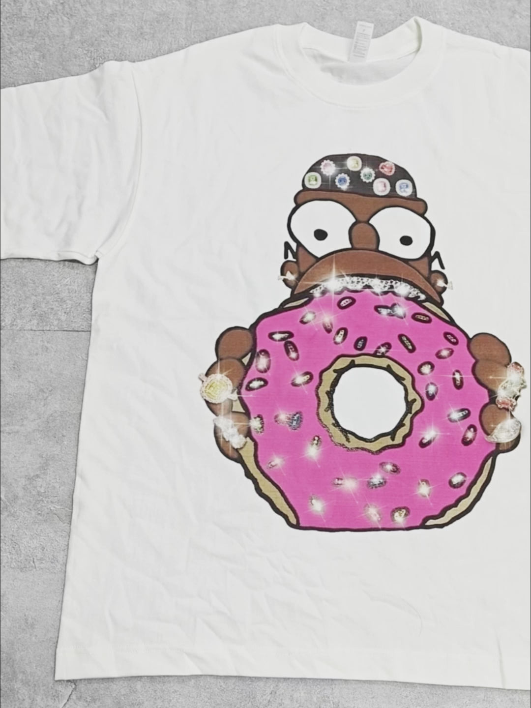 Taking a big bite out of a diamond donut cartoon print T-shirt