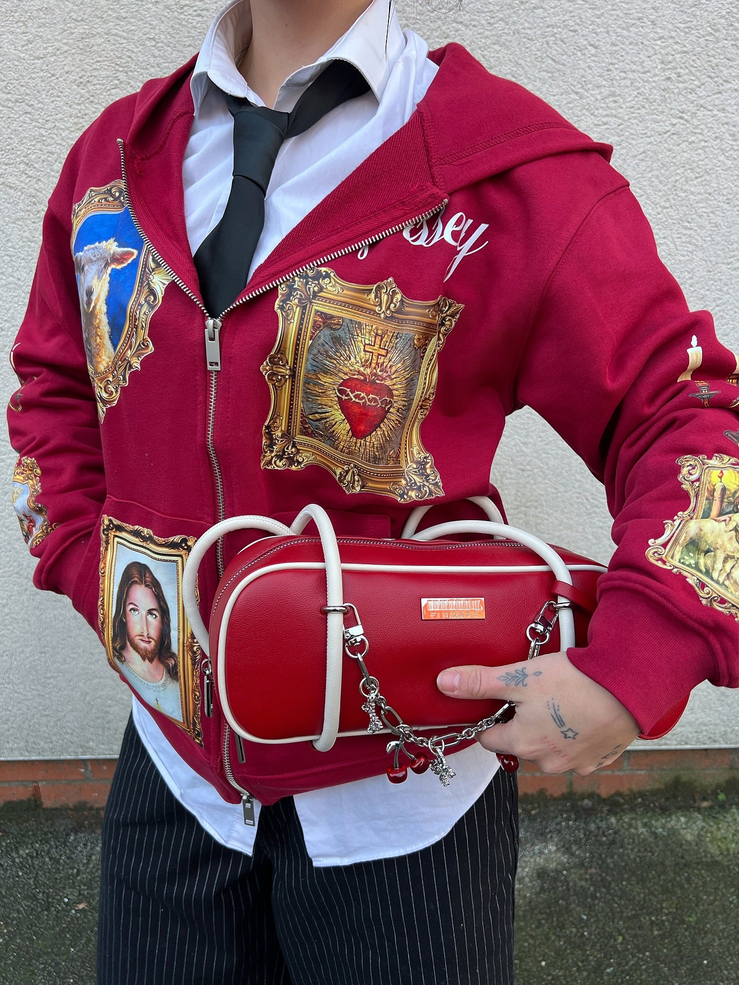 Red Hoodie Adorned with Religious Icons